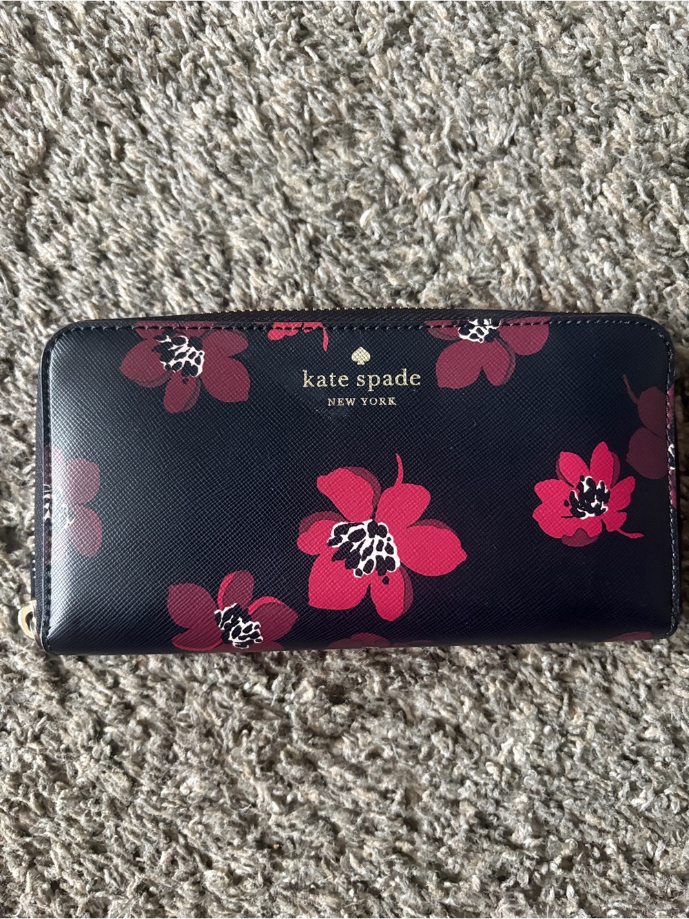 kate spade navy zip-around wallet with bright pink floral print
